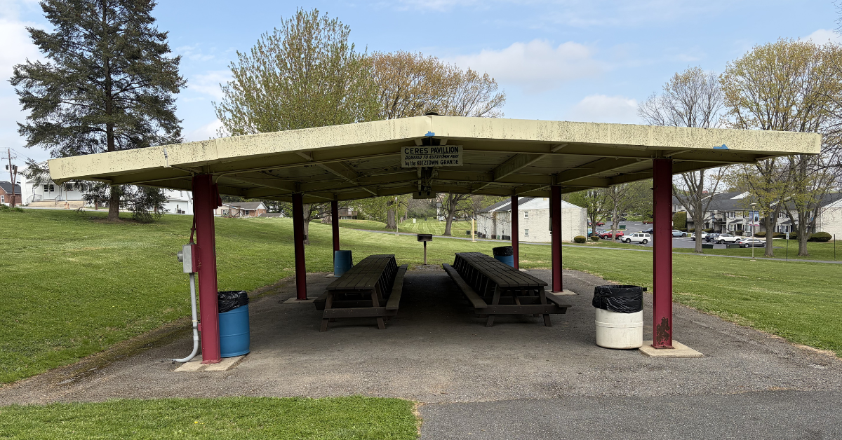 Kutztown Park Ceres Pavillion, donated by the Grange, next to park parking lot with Kutztown Grange No. 1836 building in background