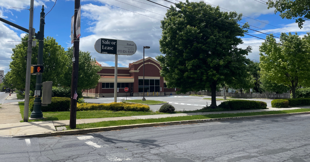 Vacant property with for sale or lease sign at 23 N Elm Street, Kutztown, PA